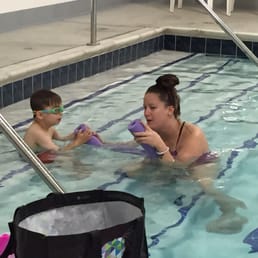 Miss Kelly making the pool noodle "talk" to my son. Miss Kelly making the pool noodle "talk" to my son.