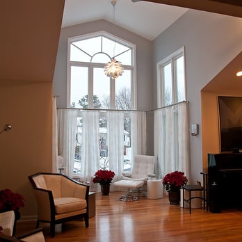 Faddegon's Building & Remodeling - a living room with large windows and a piano - General Contractors Near Me - Latham, New York Faddegon's Building & Remodeling - a living room with large windows and a piano - General Contractors Near Me - Latham, New York