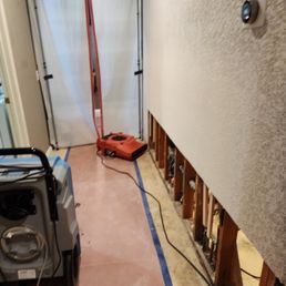 They carefully cover the area to protect the rest of the house with a zipper curtain.
