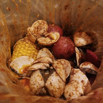 Shaking Crab - 1lb Clams (mild garlic butter sauce) added side of sausages w/ red skin potatoes & corn on the cob - Cajun/Creole Near Me - Indianapolis, Indiana Shaking Crab - 1lb Clams (mild garlic butter sauce) added side of sausages w/ red skin potatoes & corn on the cob - Cajun/Creole Near Me - Indianapolis, Indiana