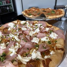 Mortadella and margherita pizzas. Mortadella and margherita pizzas.