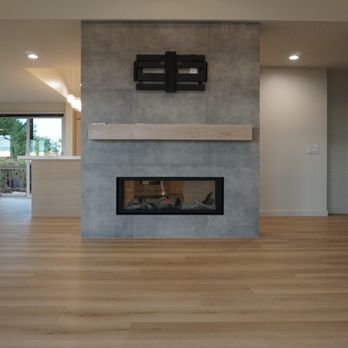 Distinct Remodeling - New and improved fireplace!- part of a full remodel project completed in Bellevue - General Contractors Near Me - Bellevue, Washington Distinct Remodeling - New and improved fireplace!- part of a full remodel project completed in Bellevue - General Contractors Near Me - Bellevue, Washington
