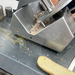 Dirty area and slicer is disgustingly worse, looks like it hasn't been wiped down all day.