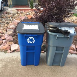 Giant Blue Recycling Bin next to trash bin that ProDisposal refuses to pick up recycling in.