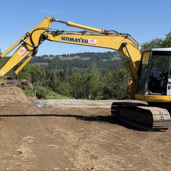 Moore & Moore Services - A larger Komatsu excavator - Junk Removal & Hauling Near Me - Homer, Alaska Moore & Moore Services - A larger Komatsu excavator - Junk Removal & Hauling Near Me - Homer, Alaska