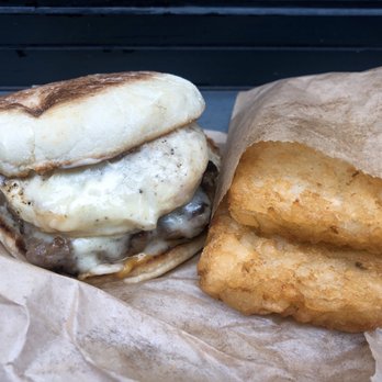 Iggy's Eggies - Egg Sandwich on an English Muffin with Sausage and Swiss Cheese, and a side of Hash Browns - Breakfast & Brunch Near Me - Detroit, Michigan Iggy's Eggies - Egg Sandwich on an English Muffin with Sausage and Swiss Cheese, and a side of Hash Browns - Breakfast & Brunch Near Me - Detroit, Michigan
