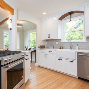 EcoCraft llc - a kitchen with white cabinets and stainless steel appliances - General Contractors Near Me - Lake Oswego, Oregon EcoCraft llc - a kitchen with white cabinets and stainless steel appliances - General Contractors Near Me - Lake Oswego, Oregon