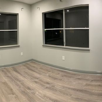 Fujishige Construction - empty room with wood floors - General Contractors Near Me