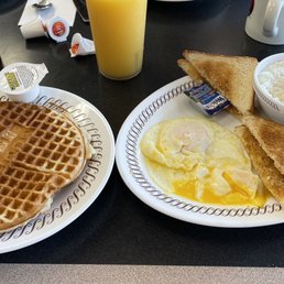 two plates of breakfast food