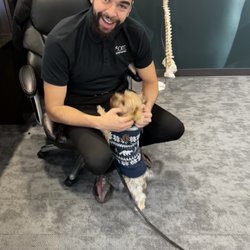 The Joint Chiropractic - Dr Eli. with our mascot, Maui.
