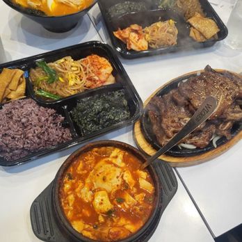 Enjoy Seoul - Soft tofu seafood soup spiciness level hot, banchan, grilled beef ribs, and chicken ramen spiciness level mild - Korean Near Me - San Jose, California Enjoy Seoul - Soft tofu seafood soup spiciness level hot, banchan, grilled beef ribs, and chicken ramen spiciness level mild - Korean Near Me - San Jose, California