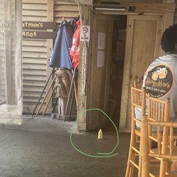 a man sitting at a table with a banana in front of him