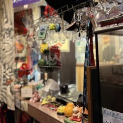 Musashi Exotic Japanese Cuisine - More decor near the cash register. That Geisha statue is so beautiful!