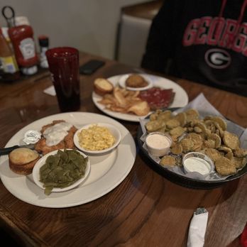 Crow's Nest - two plates of food on a table - Sports Bars Near Me - Nashville, Tennessee