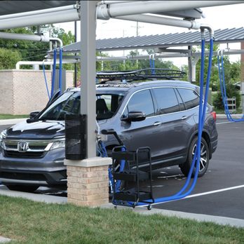 Pure Clean Car Wash - A car is parked in the parking lot of a car wash - Car Wash Near Me - Franklin, Tennessee Pure Clean Car Wash - A car is parked in the parking lot of a car wash - Car Wash Near Me - Franklin, Tennessee
