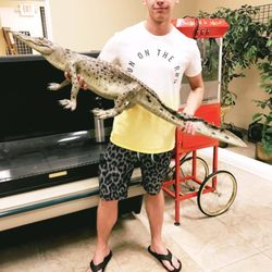 Camouflage Dave's Jerky Shop - One of our customers Ryan with "FRED" our Gator ONLY at Camouflage Dave's Store on Flagler Ave, New Smyrna Beach, FL.
