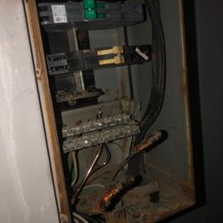 Mckenzie Electric - Breaker box that had arced.