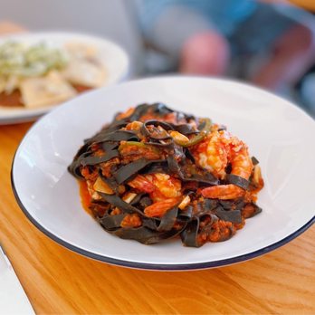 Flourshop - a plate of food on a table - New American Near Me - Charlotte, North Carolina