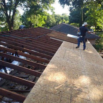Reflections Roofing - Taking off old plywood and replacing it with new radiant barrier - Roofing Near Me