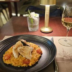 Grand Hotel - Milk fish over tomato rice with a glass of local Azorean wine. Absolutely phenomenal dinner.