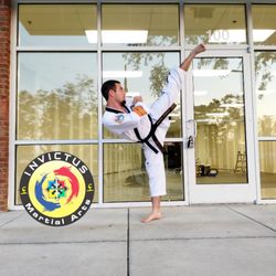 Invictus Martial Arts - Ready for some awesome martial arts training! Owner, Master Max Crucitti kicking in front of Invictus Martial Arts!