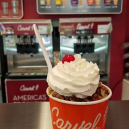 a cup of ice cream and a spoon