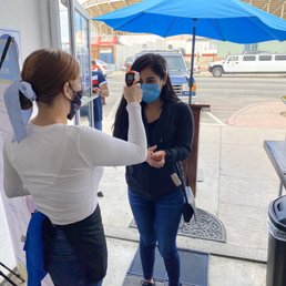 Checking the temperature before coming in during 2020 quarantine