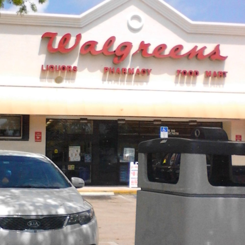a car parked in front of a walgreens store a car parked in front of a walgreens store