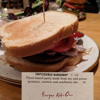 Good Earth - Impossible Burger.  Foreground on sourdough.  Background on gluten free but.  Note the upcharge for onions. - New American Near Me - Edina, Minnesota