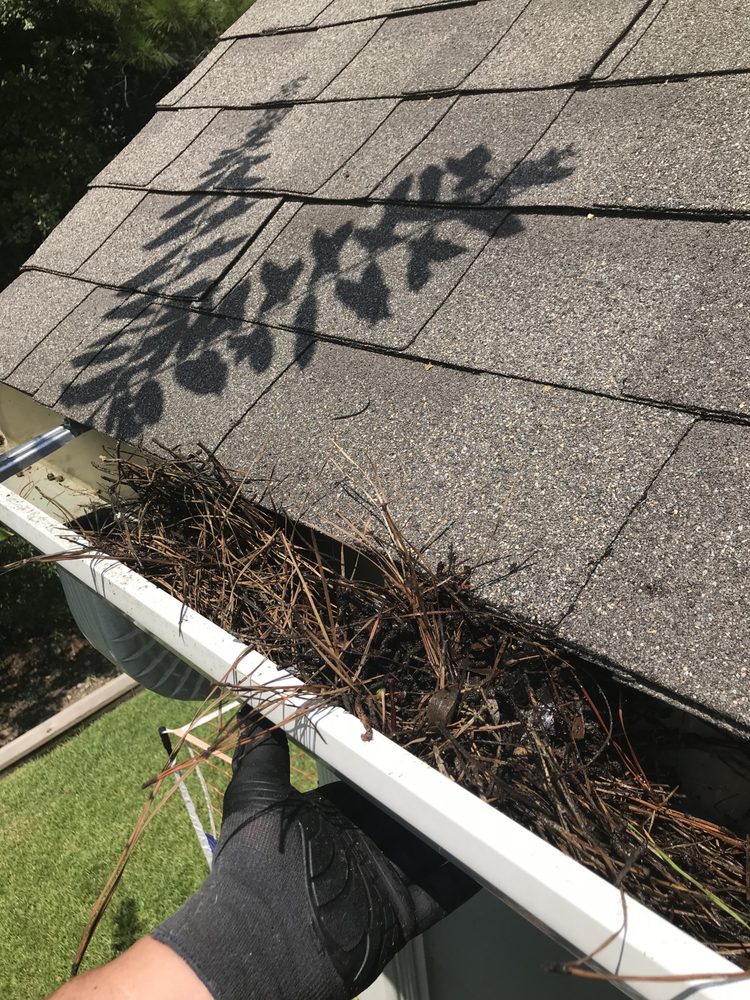 Slide of Gutter Clutter Cleaning & Roof Repair