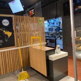 a cleaning station with a broom