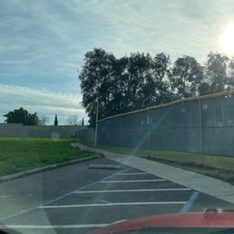 The entire to the big dog park. It's all the way on one side of the park behind the baseball fields