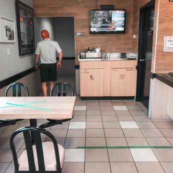Grind Hamburgers - a man standing in a kitchen - Burgers Near Me - Georgetown, Ontario Grind Hamburgers - a man standing in a kitchen - Burgers Near Me - Georgetown, Ontario