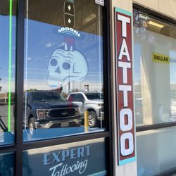 High Class Tattoo - Sign on front window.
