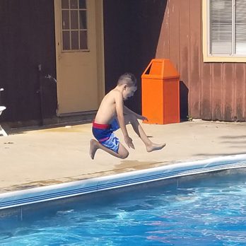 Covered Wagon Camp Resort - Jumping in the pool - Resorts Near Me - Ottawa Lake, Michigan Covered Wagon Camp Resort - Jumping in the pool - Resorts Near Me - Ottawa Lake, Michigan
