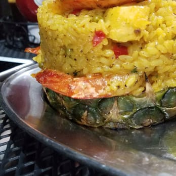 La Parrilla - Side view of Piña  Rellena de Arroz con Camarones (stuffed pineapple with rice, shrimp and pineapple) - Latin American Near Me - Luquillo, Puerto Rico