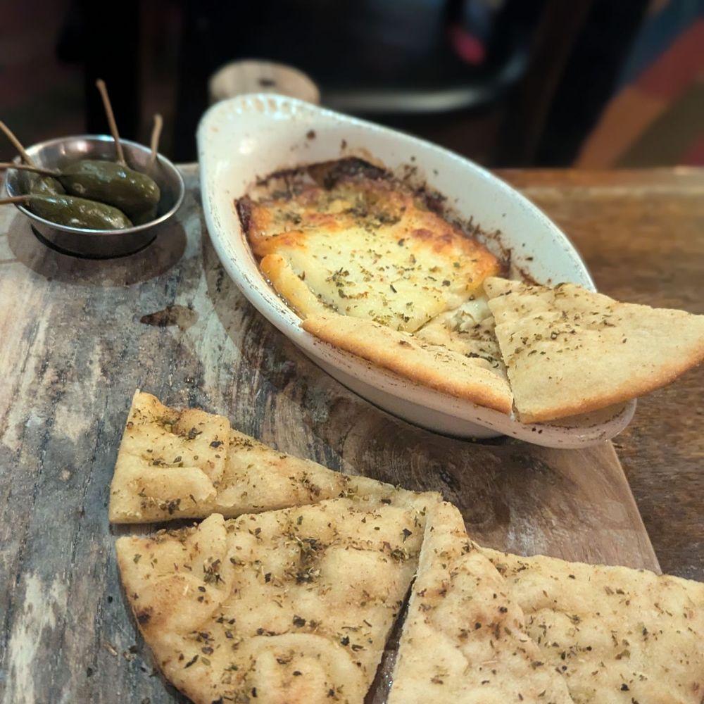 Santiago's Bodega - Saganaki with pitas - Tapas Bars Near Me - Key West, Florida Santiago's Bodega - Saganaki with pitas - Tapas Bars Near Me - Key West, Florida
