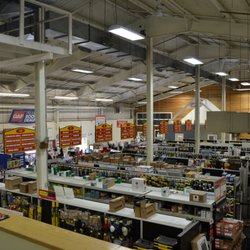 Riverhead Building Supply - Aisles stocked with fasteners, tapes, levels, and much more.
