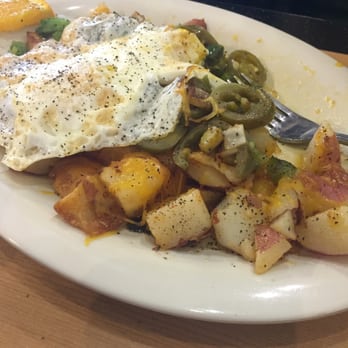 Eggs Up Grill - Eggs over medium. South western home frys. Taste delicious - Breakfast & Brunch Near Me - Myrtle Beach, South Carolina
