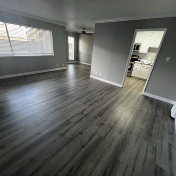 Chateau Manor - Living room, dining room in far left and kitchen entrance. - Apartments Near Me - San Leandro, California Chateau Manor - Living room, dining room in far left and kitchen entrance. - Apartments Near Me - San Leandro, California