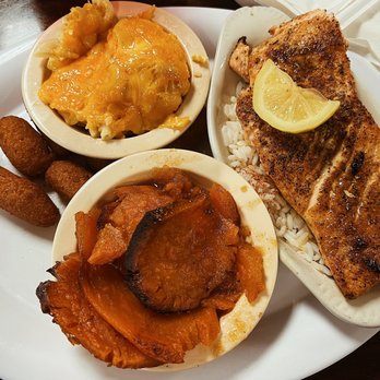 Stephanie's Restaurant - Grilled salmon with hush puppies, yams, and Mac and cheese - American Near Me - Greensboro, North Carolina
