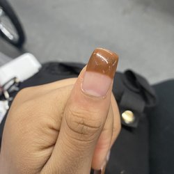 Pretty Nails - This is a "Brown Tip" . The "tip" is too thick and there is no curve to it.