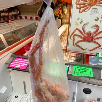 10th & M Seafoods - a person holding a bag of crab legs - Seafood Markets Near Me - Anchorage, Alaska 10th & M Seafoods - a person holding a bag of crab legs - Seafood Markets Near Me - Anchorage, Alaska