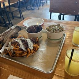 Dino beef rib, dirty fries, burnt ends, potato salad & Smoke on the Water cocktails. Dino beef rib, dirty fries, burnt ends, potato salad & Smoke on the Water cocktails.