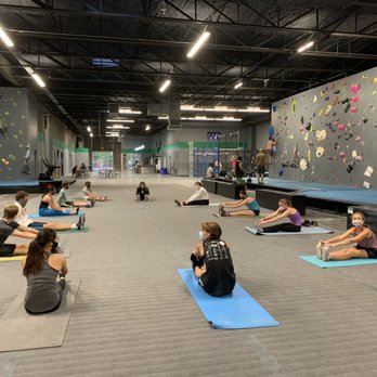 Synergy Climbing And Ninja - Lots of space at the gym! The climbing team stretches after each session. - Rock Climbing Near Me - Chattanooga, Tennessee Synergy Climbing And Ninja - Lots of space at the gym! The climbing team stretches after each session. - Rock Climbing Near Me - Chattanooga, Tennessee