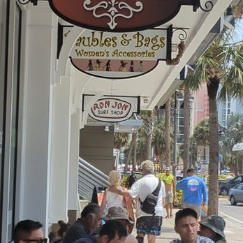 Kilwins Ice Cream - Chocolate - Fudge - Customers consuming the product are left without place to seat - Ice Cream & Frozen Yogurt Near Me - Celebration, Florida Kilwins Ice Cream - Chocolate - Fudge - Customers consuming the product are left without place to seat - Ice Cream & Frozen Yogurt Near Me - Celebration, Florida