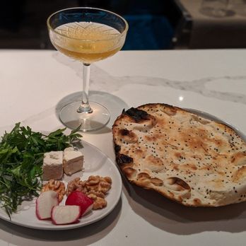 Delbar Middle Eastern - French 75 and Complimentary Crisp Sesame Seed Flatbread. - Persian/Iranian Near Me - Atlanta, Georgia Delbar Middle Eastern - French 75 and Complimentary Crisp Sesame Seed Flatbread. - Persian/Iranian Near Me - Atlanta, Georgia