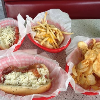 Mustard's Last Stand - Lunch for two! The hot dog on the top left is the Pesto Dog, bottom left if the Sunny dog, & top right was a special of the day. - Hot Dogs Near Me - Melbourne, Florida Mustard's Last Stand - Lunch for two! The hot dog on the top left is the Pesto Dog, bottom left if the Sunny dog, & top right was a special of the day. - Hot Dogs Near Me - Melbourne, Florida