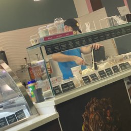 a woman behind the counter a woman behind the counter