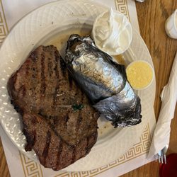 Lori's Family Restaurant - 10 oz grilled ribeye steak and amazing baked potatoe